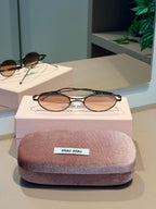 Óculos Oval Marrom - MIU MIU