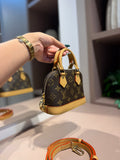 Bolsa de mão ou Transversal Alma Nano - LOUIS VUITTON