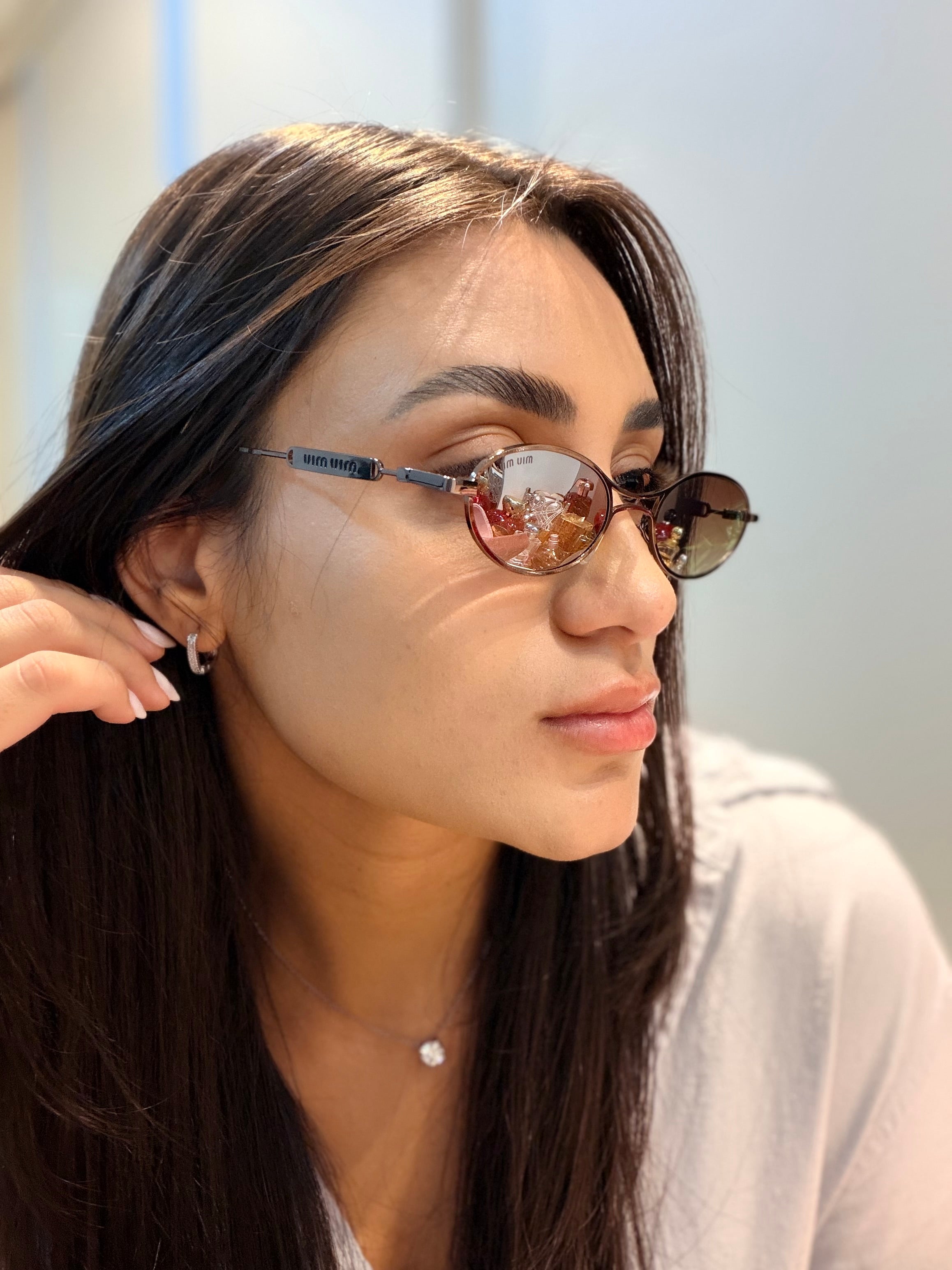 Óculos Oval Marrom - MIU MIU